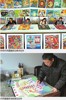 井研农民画家饶绍清在画画.jpg
